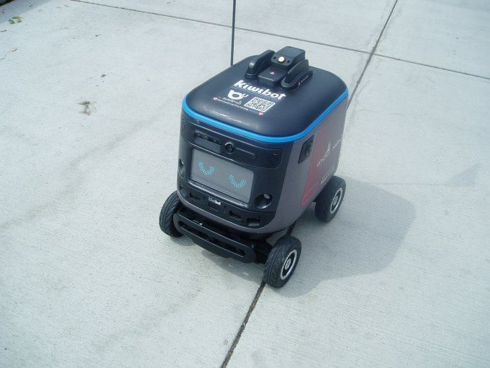 A mobile robot patrols the campus