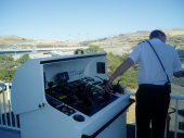 The captain controls the direction of thrust of the starboard Z-Drive, as he maneuvers the ship