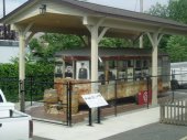 An old trolley car next to the museum