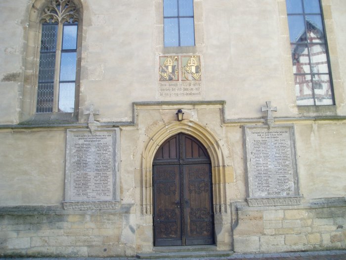 Church in Ofterdingen, Germany.  On either side of the door are memorials listing the townsmen who died in World War I.